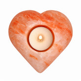 Himalayan salt heart tea light candle holder Heart-shaped Himalayan salt candle holder Natural Himalayan salt heart tea light holder Handcrafted Himalayan salt candle holder Himalayan salt heart with warm amber glow 4 inch Himalayan salt heart candle holder Natural salt heart tea light holder for home décor Heart-shaped salt candle holder for meditation space