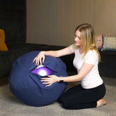 Woman showcasing zipper on exerfit Yogi Ball with Fabric Cover
