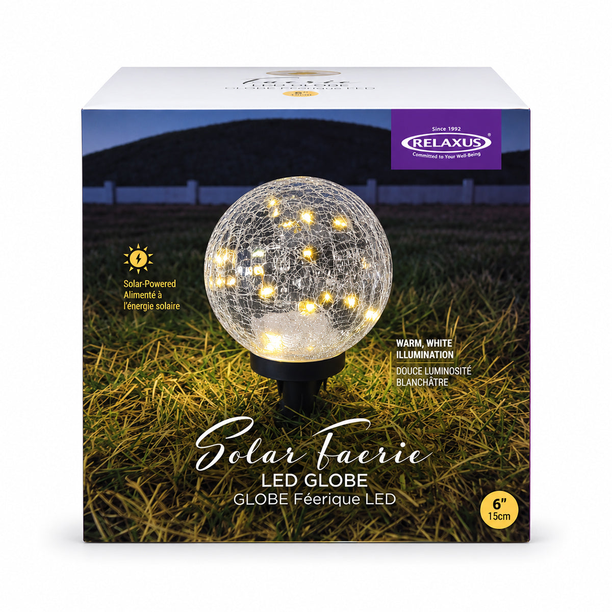 Use only descriptions that match the image shown: Solar Faerie LED Globe with detachable garden stake; Hand-blown crackle glass solar globe; Solar Faerie LED Globe illuminated at dusk; Crackle glass globe displayed in a garden; Solar LED globe on a patio table without its stake; Close-up of the Solar Faerie LED Globe crackle glass; Medium Solar Faerie LED Globe, 15 cm diameter.