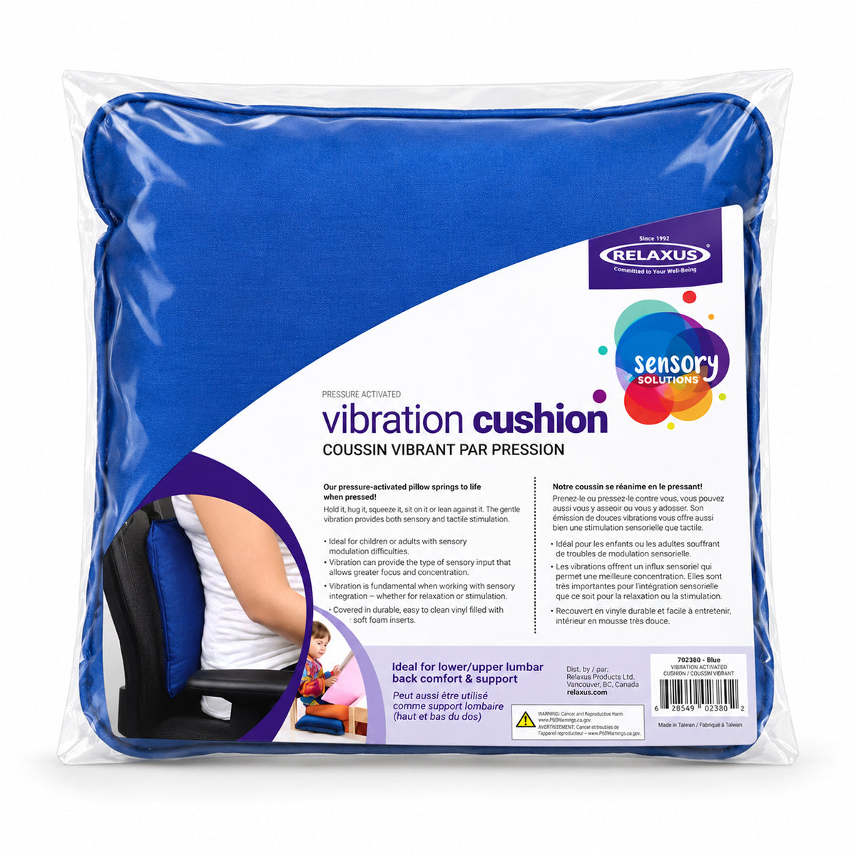Sensory Solutions pressure-activated vibration cushion; Blue vibration cushion for sensory support; Compact 30 cm sensory vibration cushion; Child seated with a vibration cushion; Pressure-activated cushion positioned against the lower back; Portable cordless vibration cushion; Vinyl sensory cushion with soft foam filling; Sensory Solutions Vibration Cushion packaging.