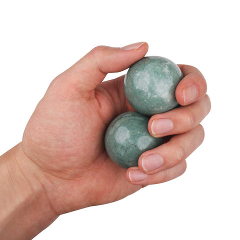 Hand holding Jade Massage Balls