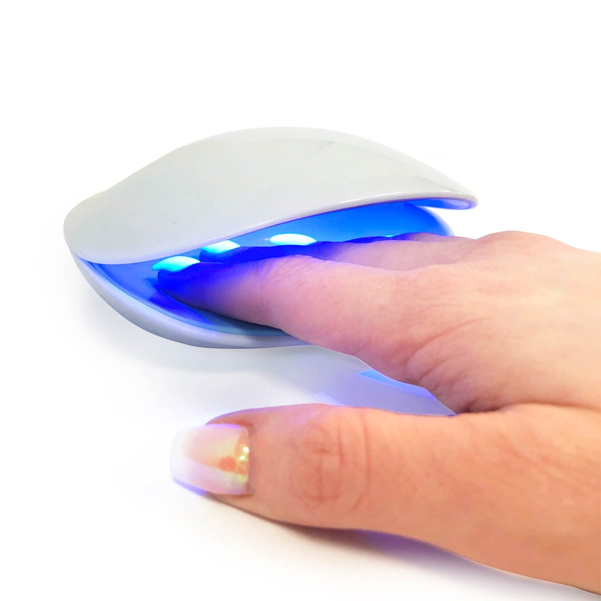 nail curing lamp with fingers in
